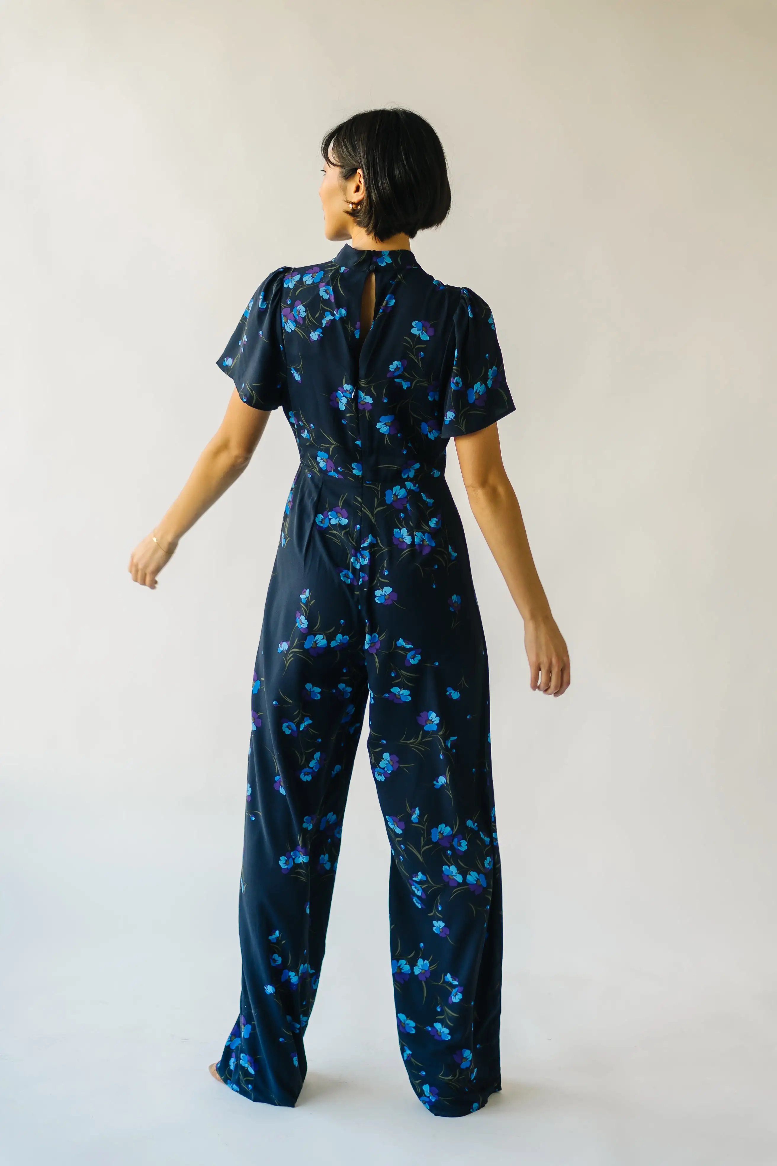 The Seldovia Mock Neck Jumpsuit in Navy + Purple